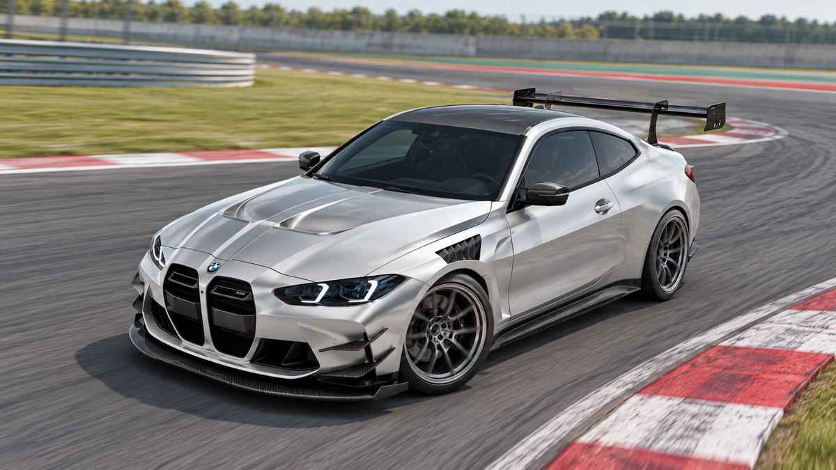 Silver BMW M4 G82 with REVOZPORT Race aero entering a closed-circuit corner