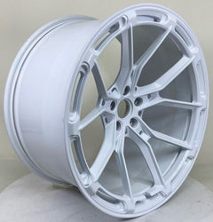 White REVOZPORT forged alloy wheel with lightweight split-spoke design displayed in a clean studio setting.