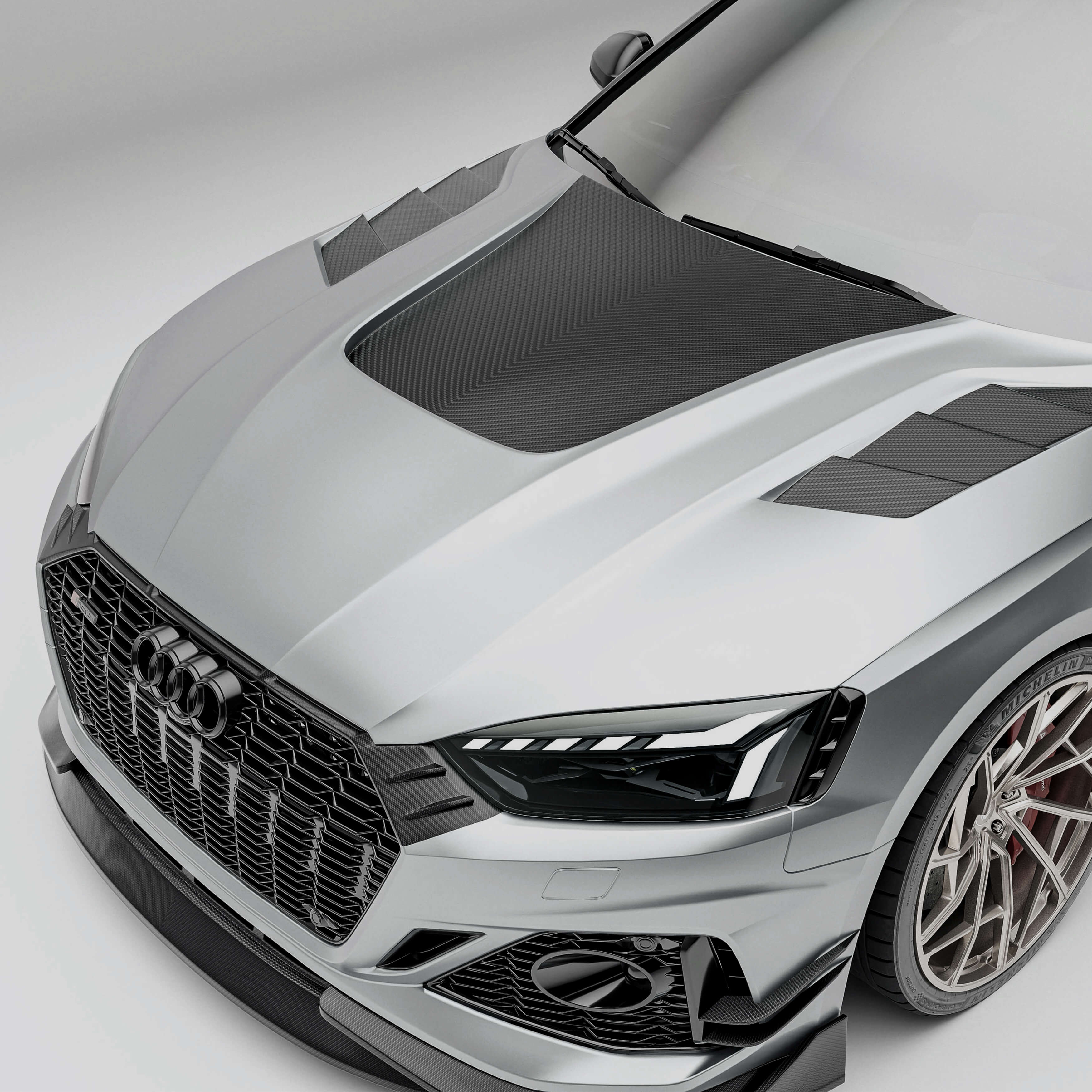 Audi car with a carbon fiber hood a white background