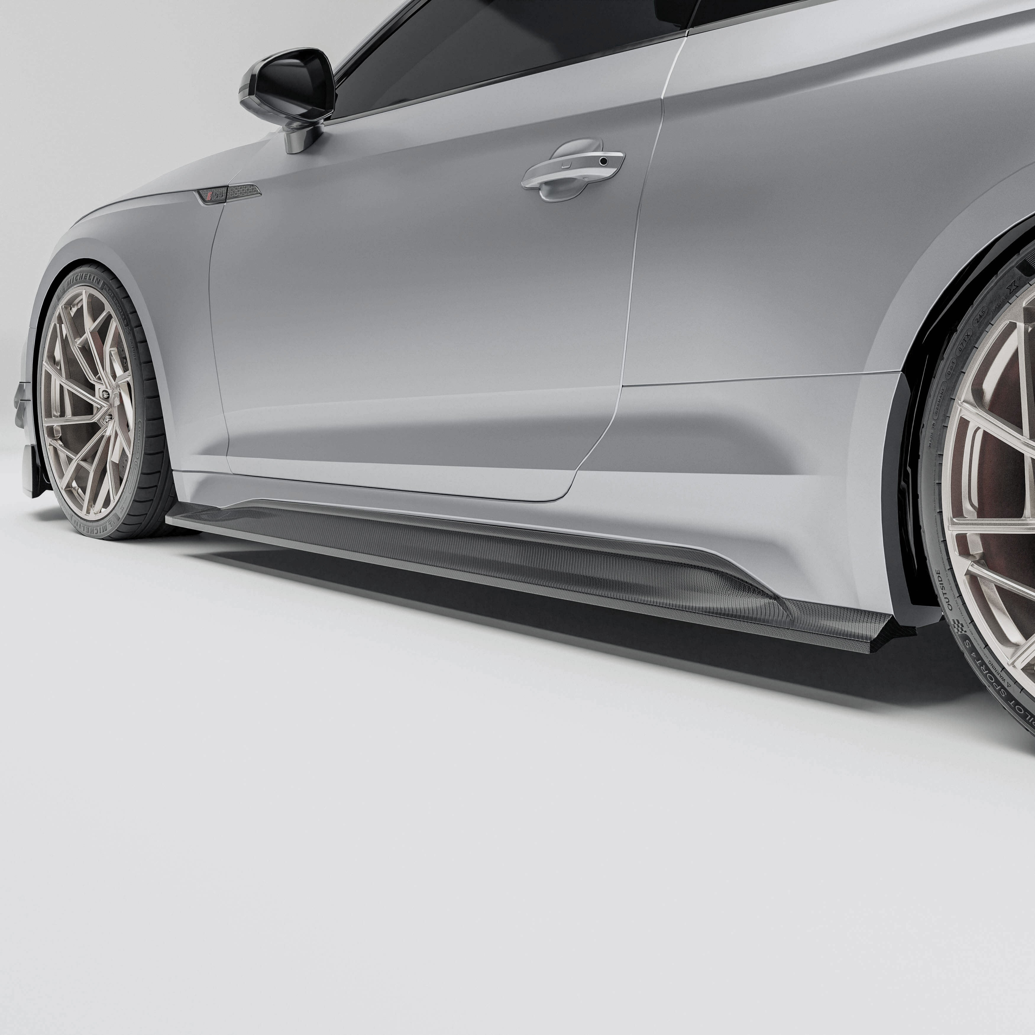 Audi car with a carbon fiber side skirts a white background