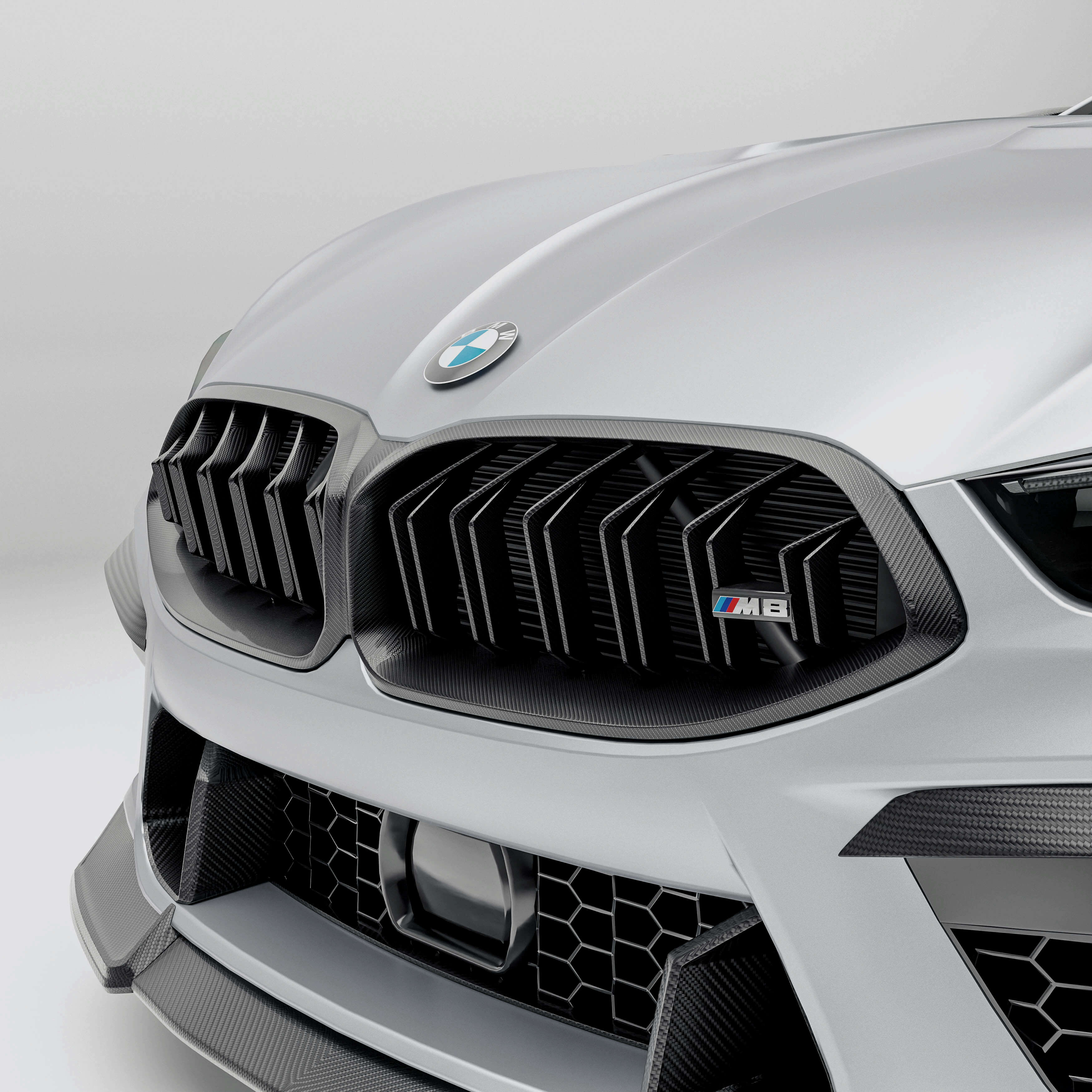 bmw-m8-f92--with-a-carbon-fiber-grille-front-angle-on-a-white-background