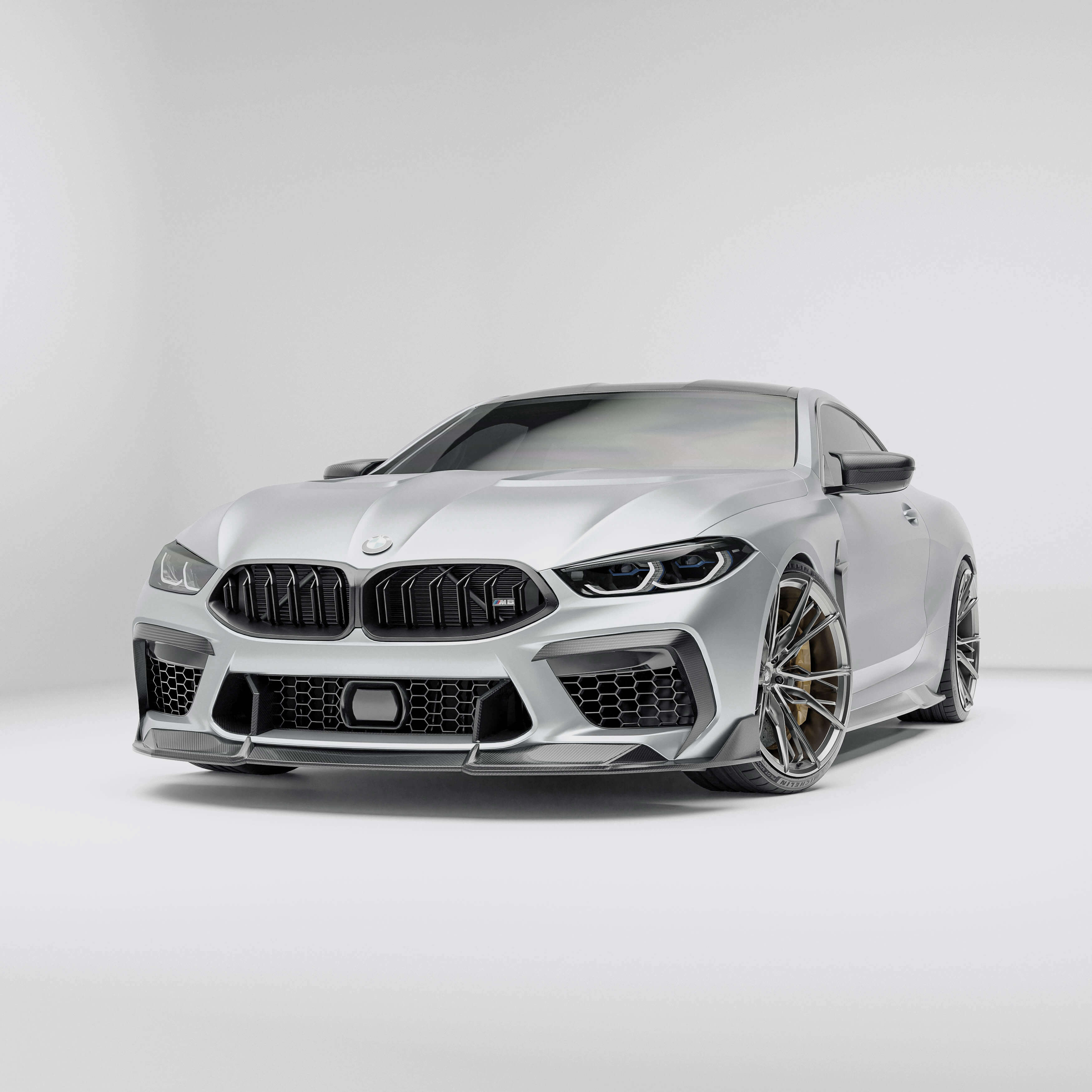 BMW M8 F92  with a carbon fiber front lip on a white background