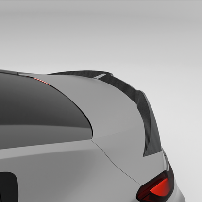 BMW car with a carbon fiber rear spoiler on a white background