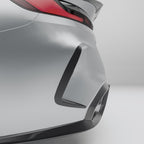 close-up-of-a-car's-rear-bumper-with-carbon-fiber-texture-on-a-gray-background